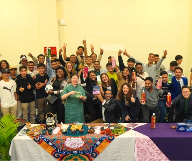 Students celebrating together over a shared meal